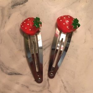 pair of strawberry metal hair clips